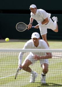 File-This July 5, 2016, file photo shows Mike Bryan, front, and Bob Bryan of the U.S return to Nenad Zimonjic of Serbia and Radek Stepanek of the Czech Republic during their men's doubles match on day eight of the Wimbledon Tennis Championships in London. Bob and Mike Bryan will not defend their Olympic doubles title in Rio, citing health concerns. The twins announced their withdrawal on their Facebook page Saturday, July 30, 2016, saying that as 