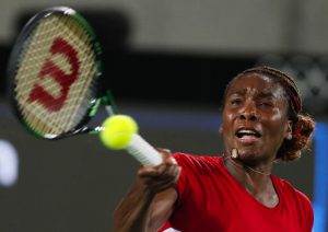 Venus Williams of the United States returns a ball to Belgium's Kirsten Flipkens in the women's tennis competition at the 2016 Summer Olympics in Rio de Janeiro, Brazil, Saturday, Aug. 6, 2016. (AP Photo/Vadim Ghirda)