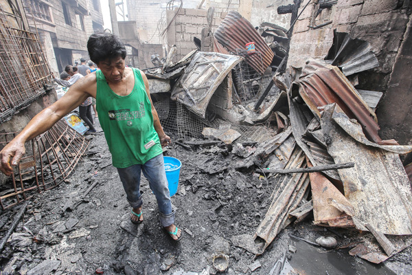 QC: Bata patay, 200 pamilya nasunugan